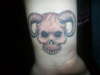 aries/skull tattoo