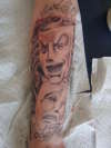 happy sad face tattoo