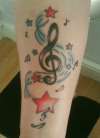 Treble Cleff , music notes and stars tattoo