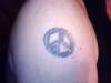 peace/69 sign tattoo