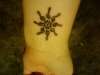 Treble Sun tattoo