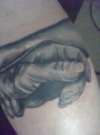 gripping hands tattoo