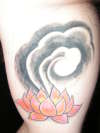 Inner arm: Lotus and cloud tattoo