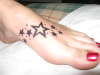 stars on foot tattoo