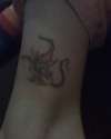 Gremlin smoking joint tattoo