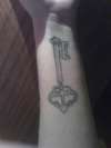 Key-left wrist tattoo