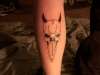 skull with horns tattoo