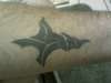 cross that says Jesus tattoo