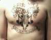 SET YOUR GOALS chest piece tattoo