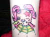 girly skull-trainee tattoo