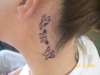 Behind Angies Ear tattoo