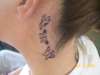 Behind Angies Ear tattoo