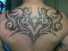 Large tribal backpiece tattoo