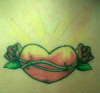 Heart between shoulder blades tattoo
