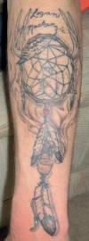 Dream catcher with peace pipe and feathers tattoo