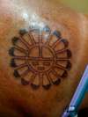 Indian sun symbol tattoo