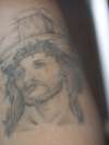 Jesus in black and grey work tattoo