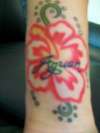 Hibiscus W Last Name tattoo