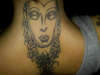 neck buddha face tattoo
