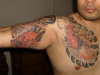 koi fish and japanese demon hungs tatto parlor tattoo
