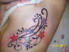 side stars and tribal tattoo