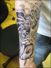 koi fish on arm tattoo