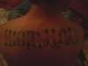 Work hard/Carpe diem ambigram tattoo