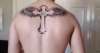 cross with wings tattoo