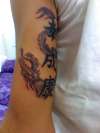 my dragon with lettering tattoo