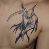 tribal/reaper tattoo