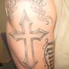 Cross (healed) tattoo
