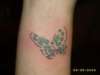 ~ butterfly on right wrist tattoo