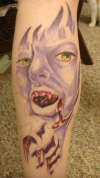 Vampire eating a heart tattoo