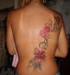 flowers on back tattoo