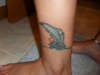 Dolphin on ankle tattoo
