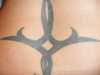 Tribal lower back tattoo