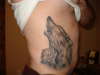 Wolf teaching a cub how to howl tattoo