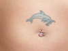 dolphin on stomach tattoo
