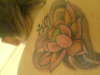 Lotus and Ohm tattoo
