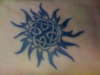 Celtic eternity knot w/ tribal sun tattoo