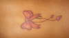 Bow & hearts tattoo