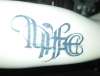 life and death lettering on inner arm tattoo