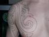 chest tribal/outline tattoo