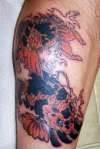 orange and black koi tattoo