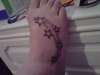 stars on wifes foot tattoo