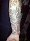 Mask Rear Right Forearm tattoo