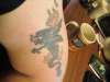Stupid Dragon, left bicep. tattoo