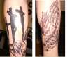 Cross and hands tattoo