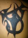 J W (overlapped) the W is a Pitch fork tattoo