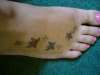 Butterfly on foot tattoo